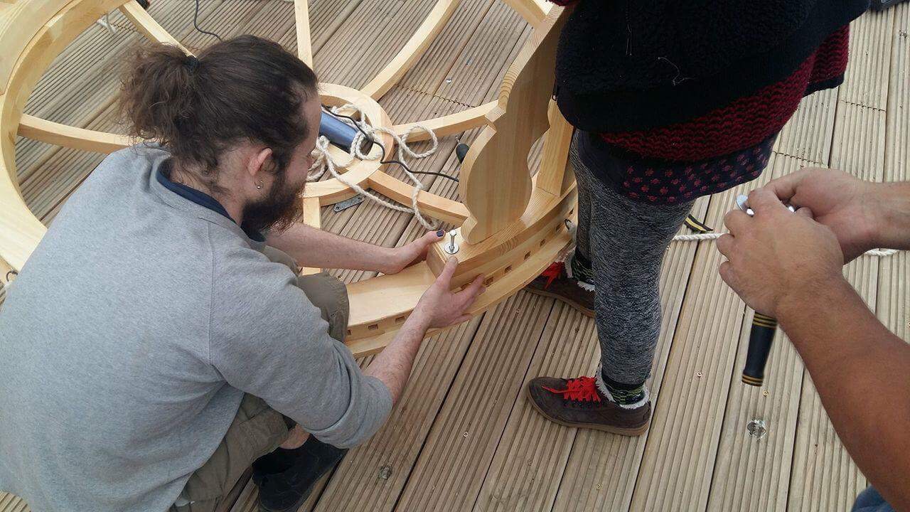 Bolting crown to stand building a yurt
