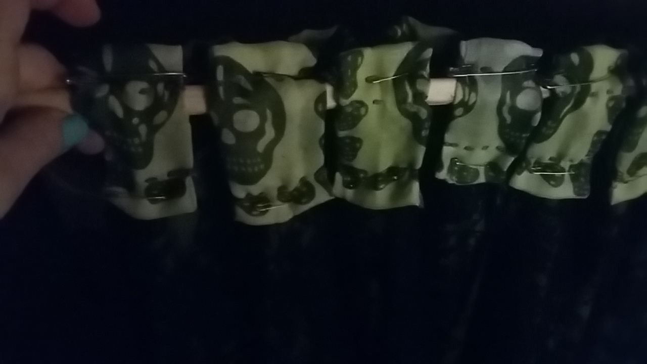 Pinned fabric green skull pattern