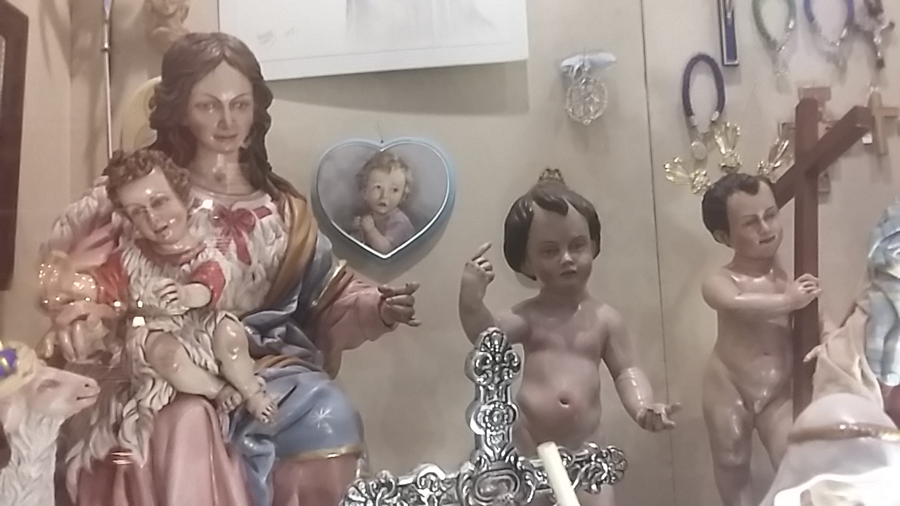 Scary virgin mary and nightmare adult faced children Scary Catholic iconography is depressing to outsiders